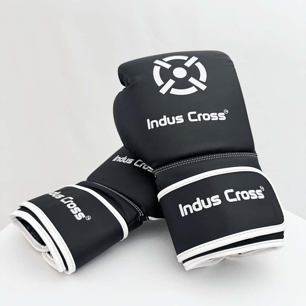 Black boxing gloves with 'Indus Cross' branding on a white background