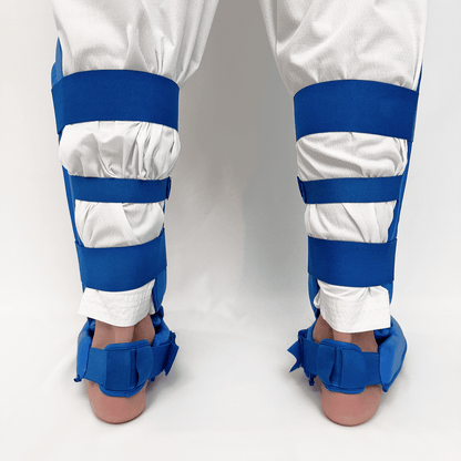 White pants with blue shin guards on a white background