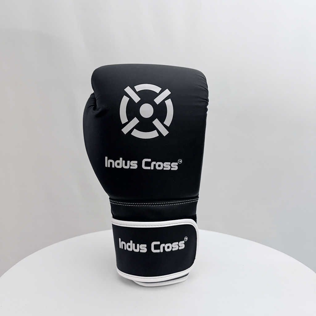 Black boxing glove with 'Indus Cross' branding on a white background