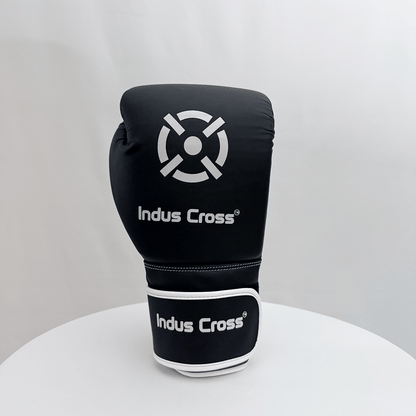 Black boxing glove with 'Indus Cross' branding on a white background