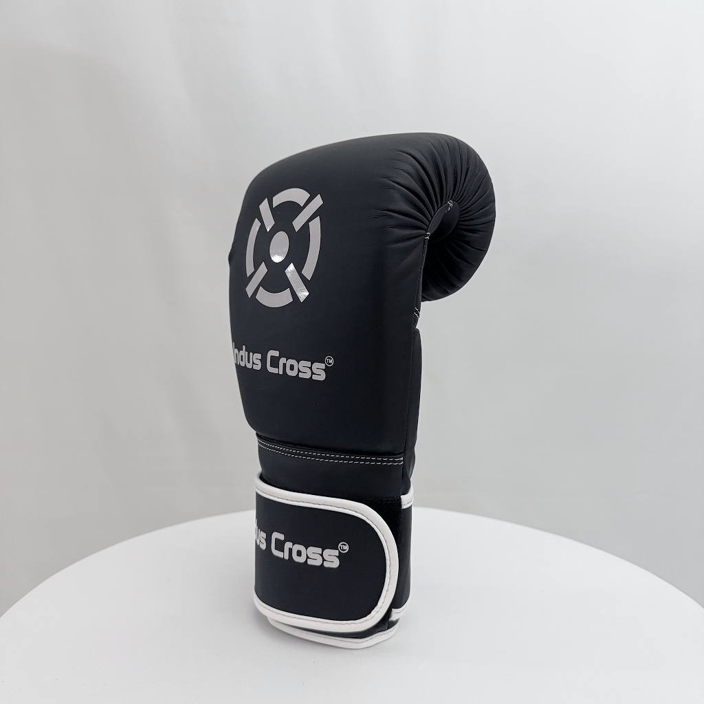 Black boxing glove with 'Nodus Cross' branding on a white background