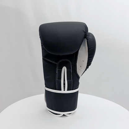 Black boxing glove on a white background