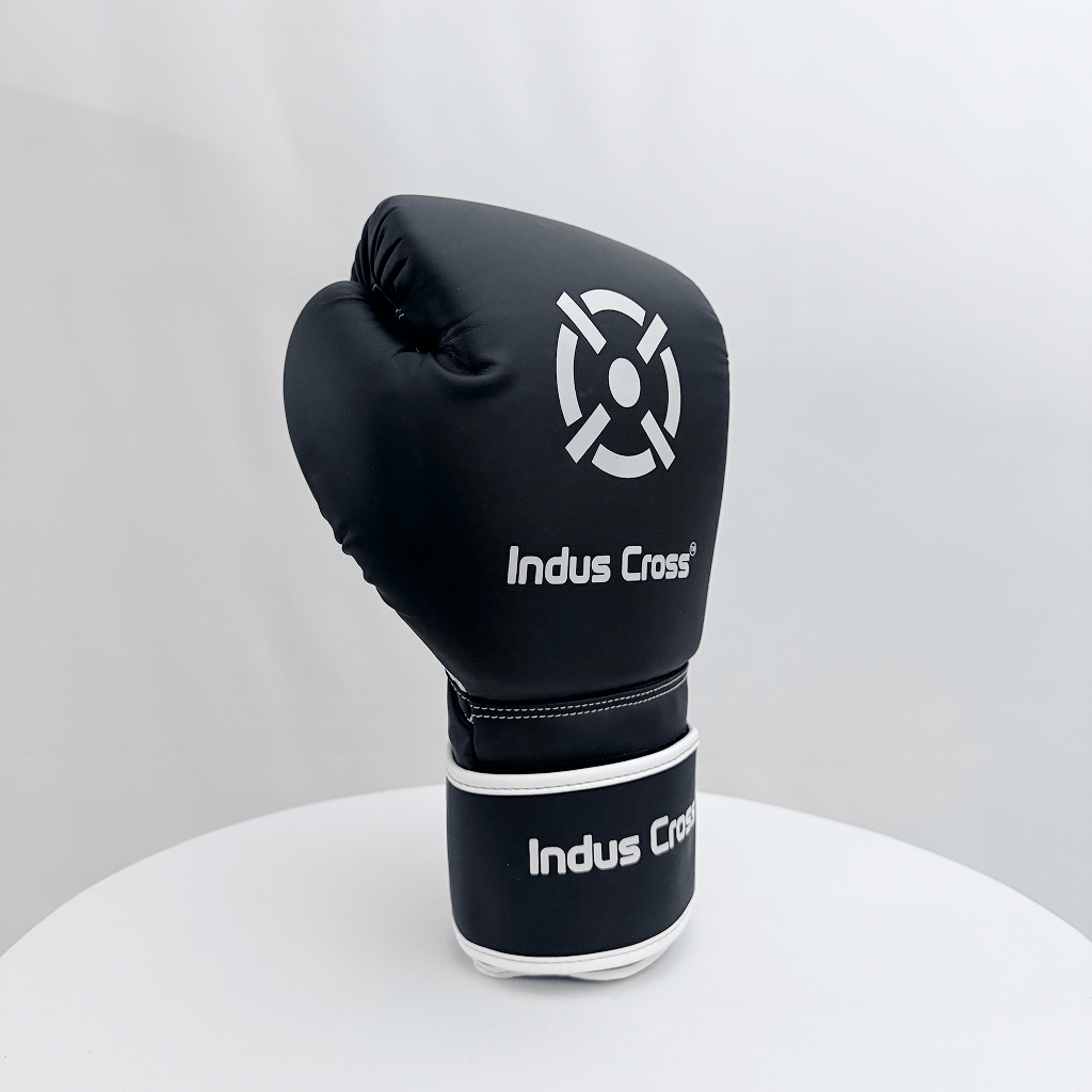 Black boxing glove with 'Indus Cross' branding on a white background