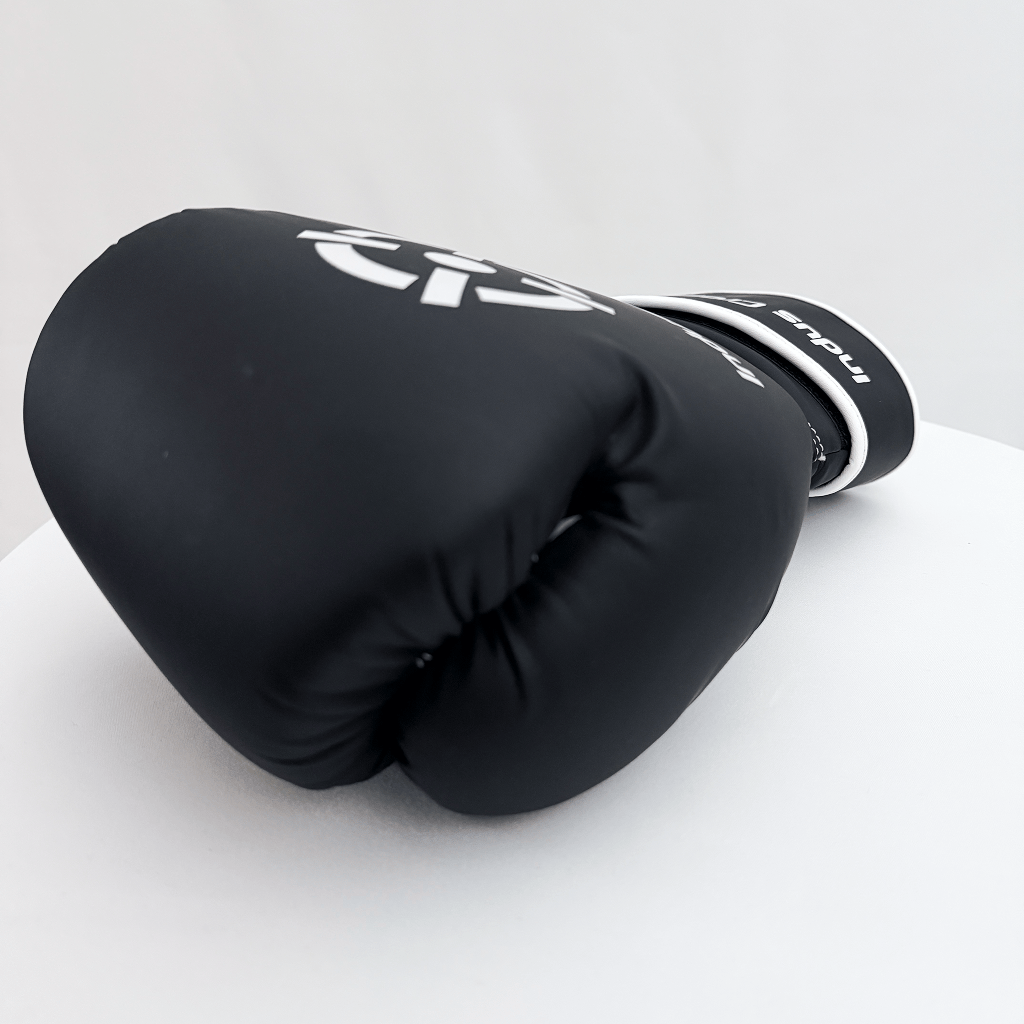 Black boxing glove on a white background