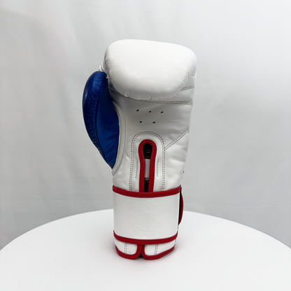 White boxing glove with blue and red accents on a white background