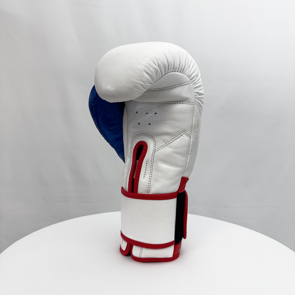 White boxing glove with blue and red accents on a white background