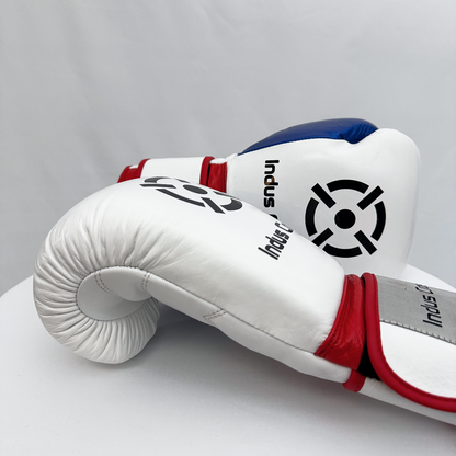 White boxing glove with red and blue accents on a gray background