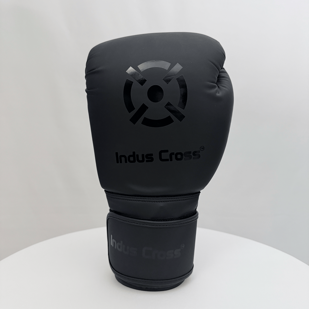 Black boxing glove with 'Indus Cross' branding on a white background