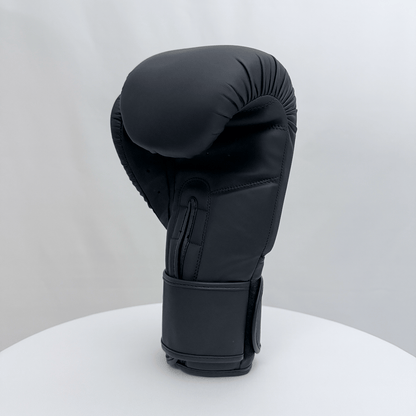 Black boxing glove on a white stand against a light gray background