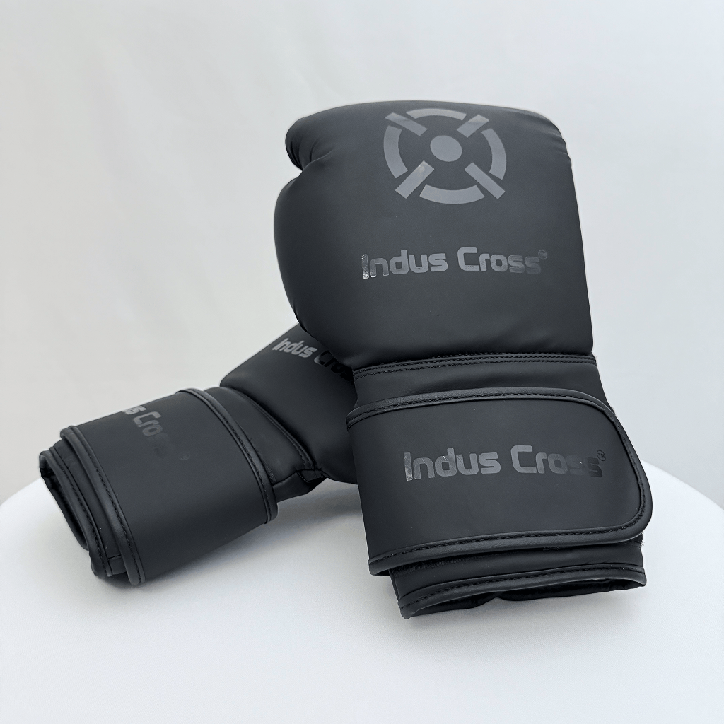 Black boxing gloves with 'Indus Cross' branding on a white background