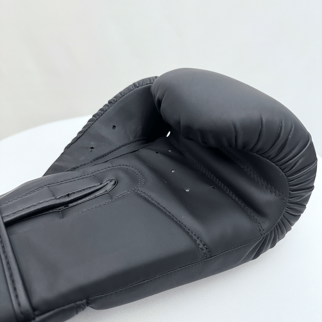 Black boxing glove on a white background