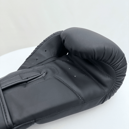 Black boxing glove on a white background