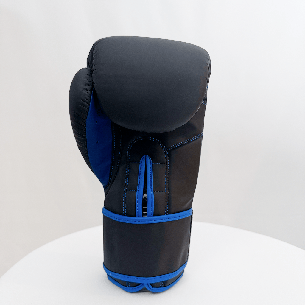 Black boxing glove with blue accents on a white background