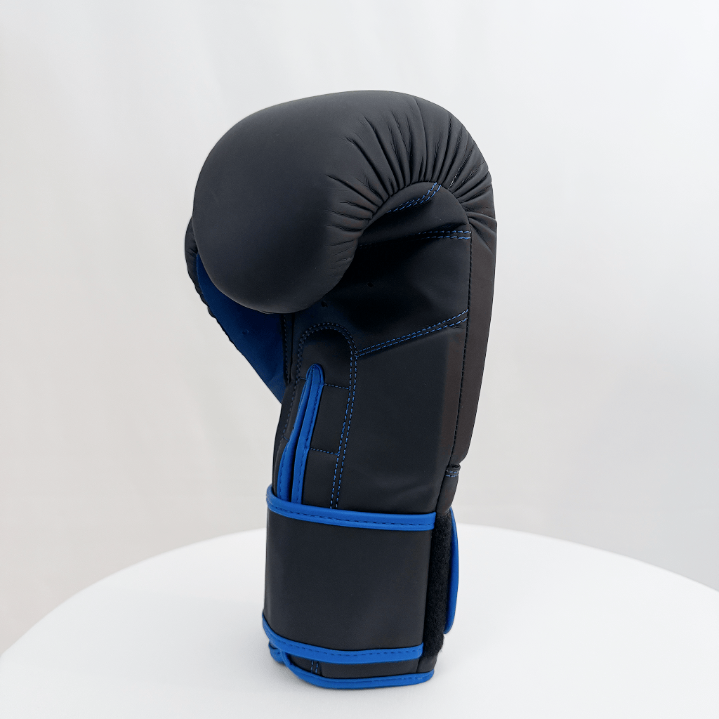 Black and blue boxing glove on a white background