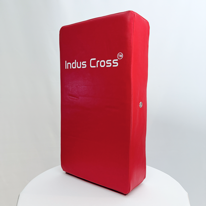 Red kick shield with 'Indus Cross' branding on a white background