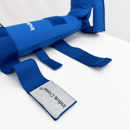 Blue shin guard with brand logo on a white background