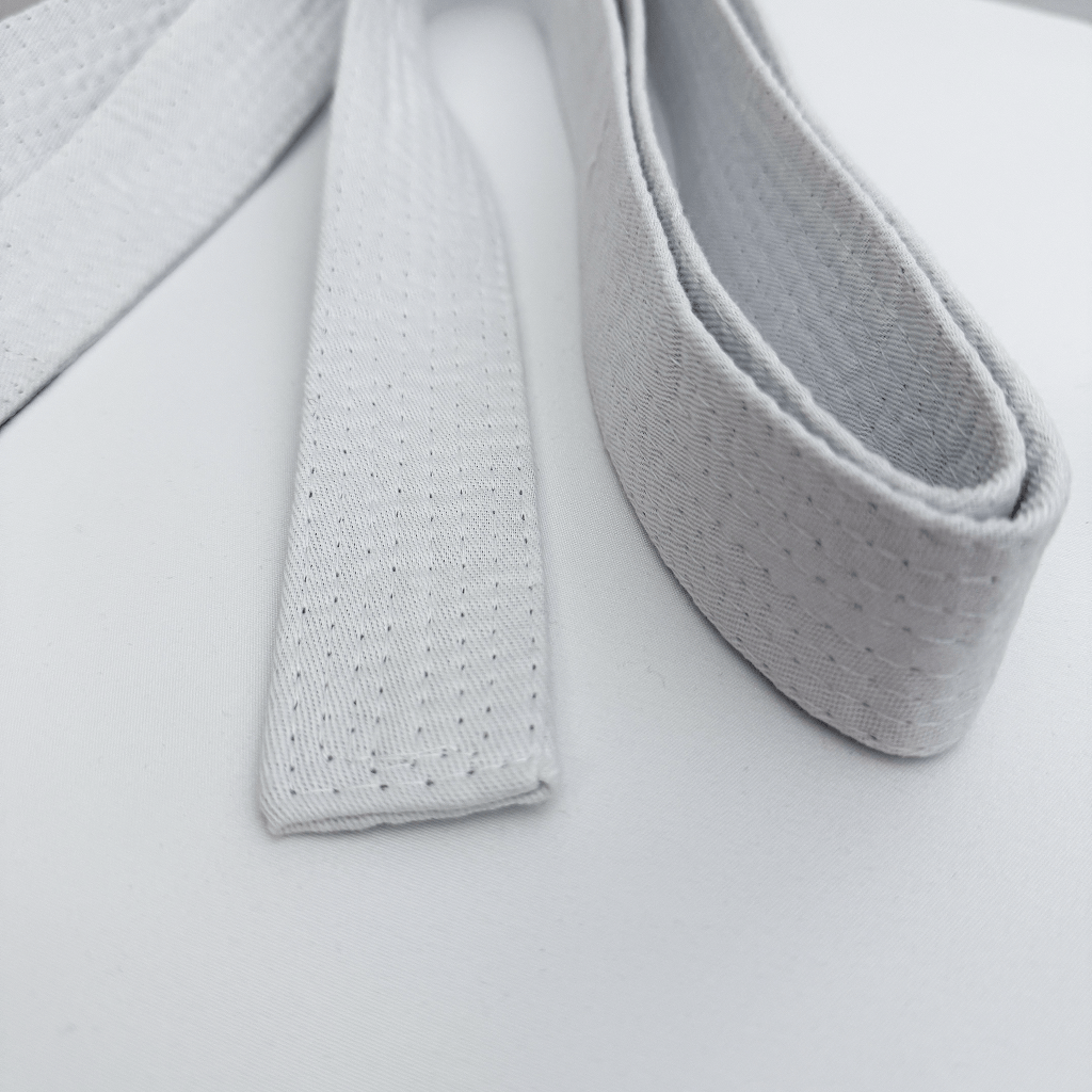Close-up of karate belt on a light gray background