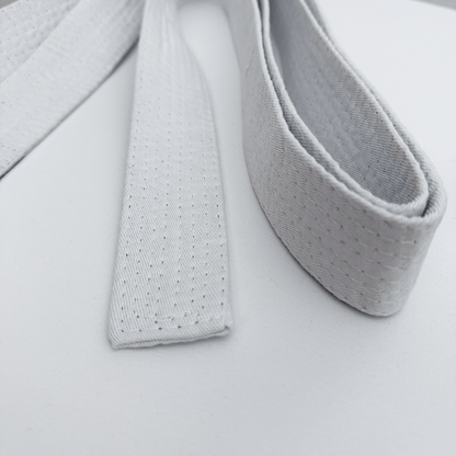 Close-up of karate belt on a light gray background