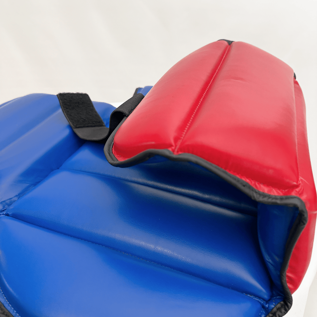 Close-up of blue and red chest guard on a white background