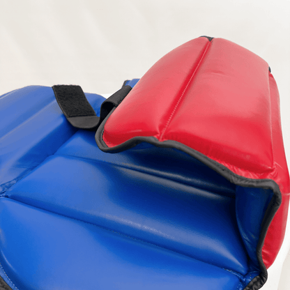 Close-up of blue and red chest guard on a white background