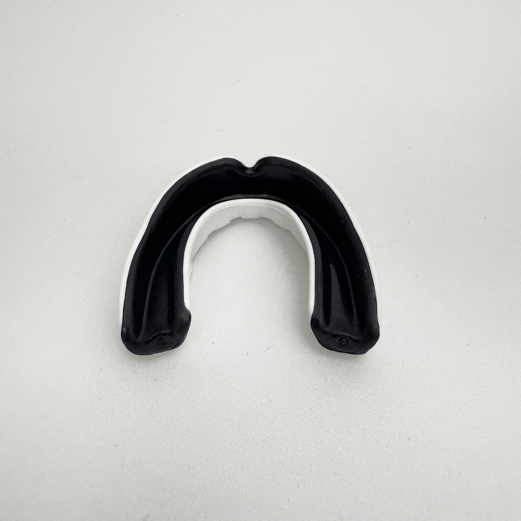 Black mouthguard on a white background