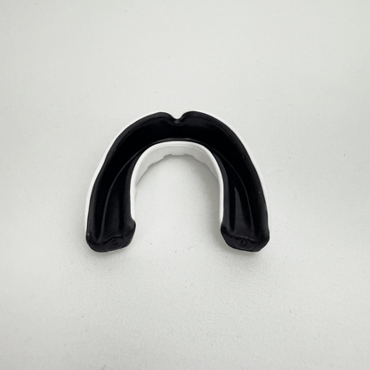 Black mouthguard on a white background