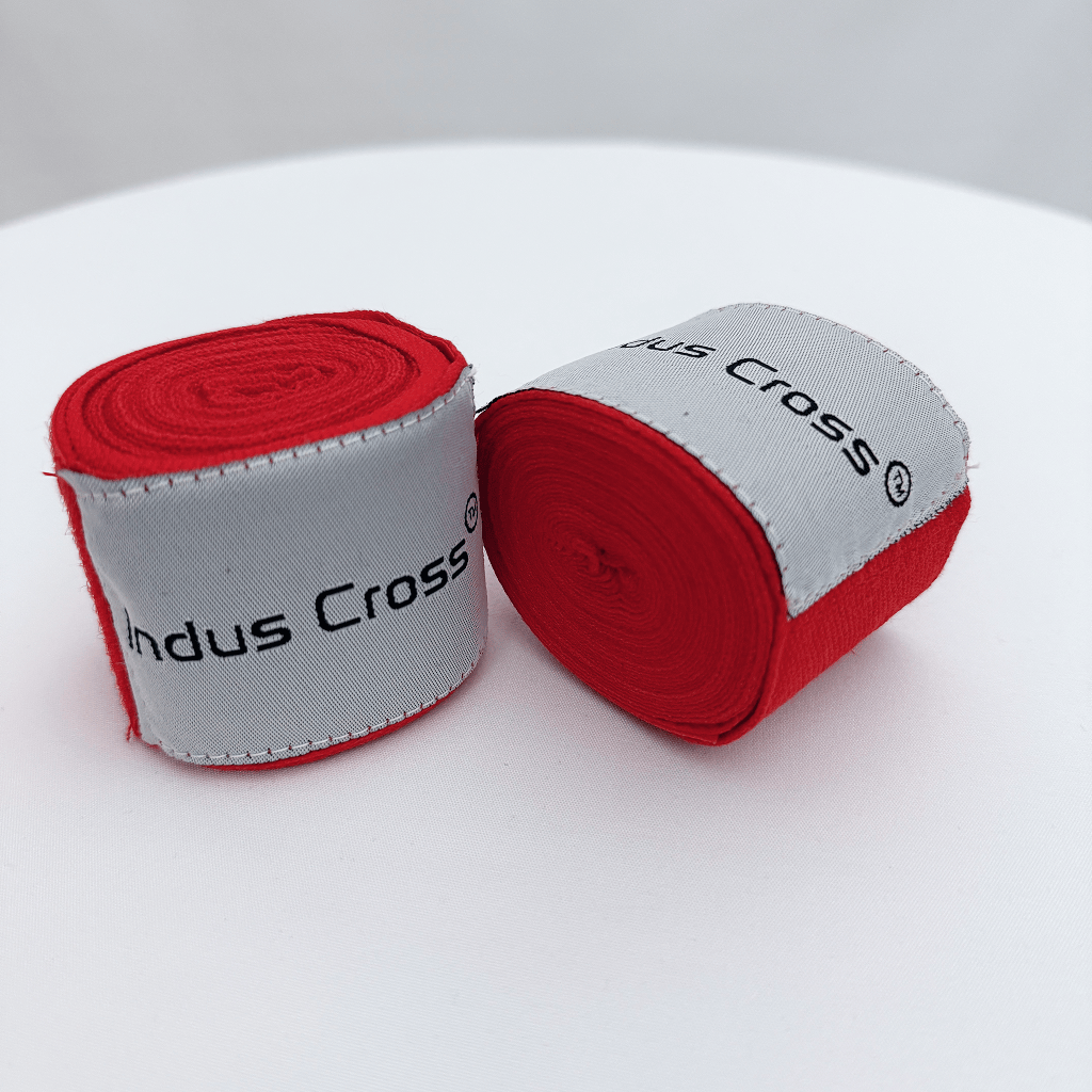 Two rolls of red hand wrap with 'Indus Cross' branding on a white background.