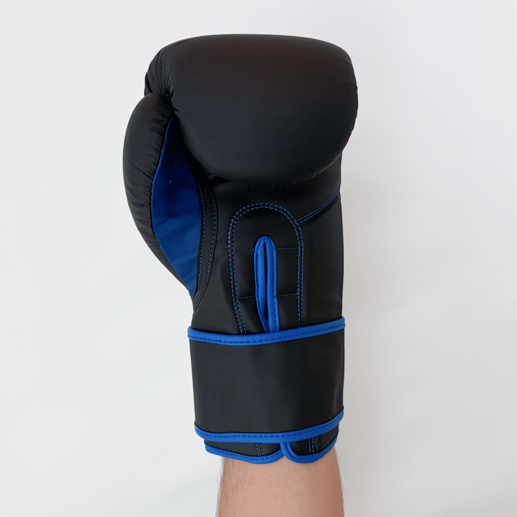 Black boxing glove with blue accents on a white background