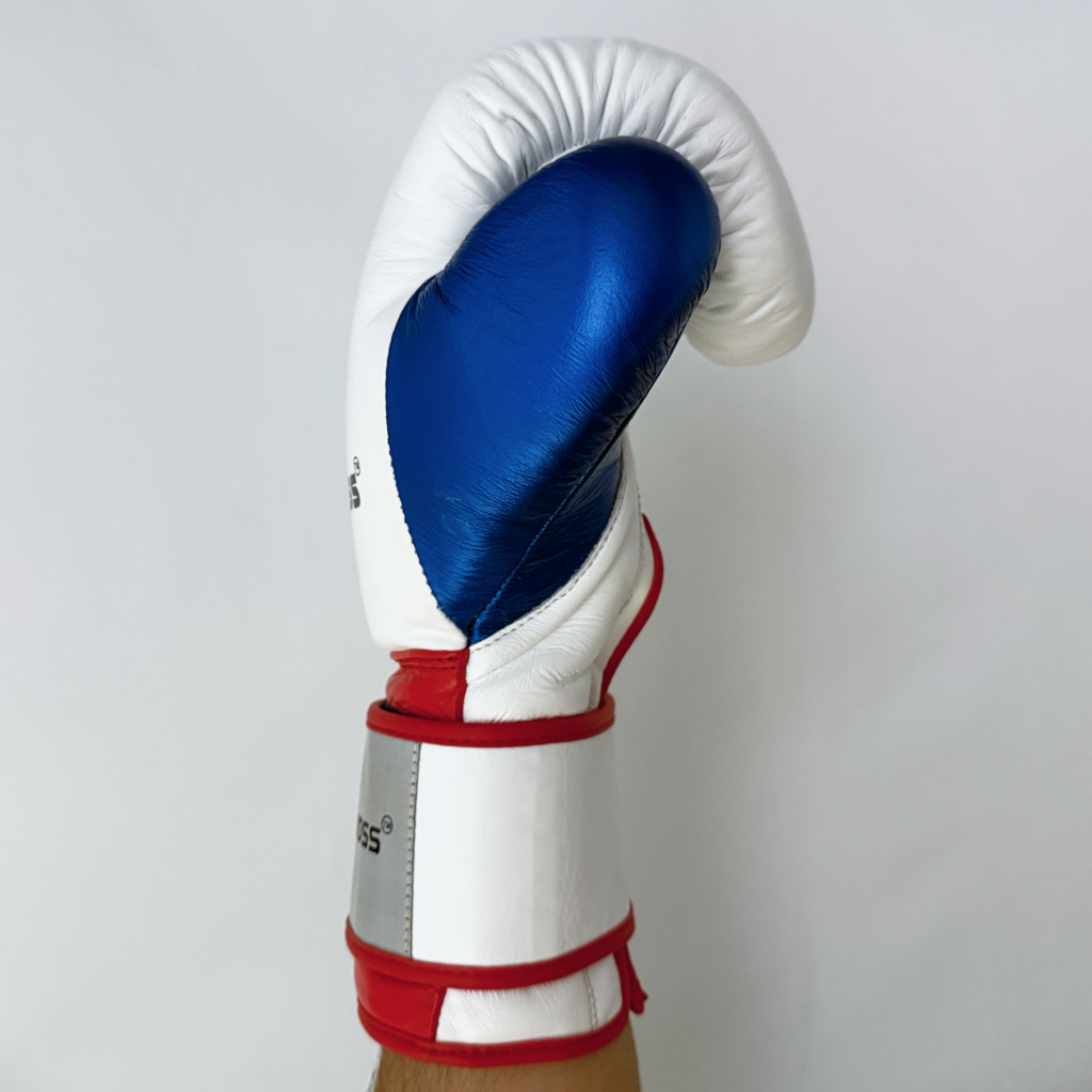 Boxing glove with blue, white, and red design on a gray background