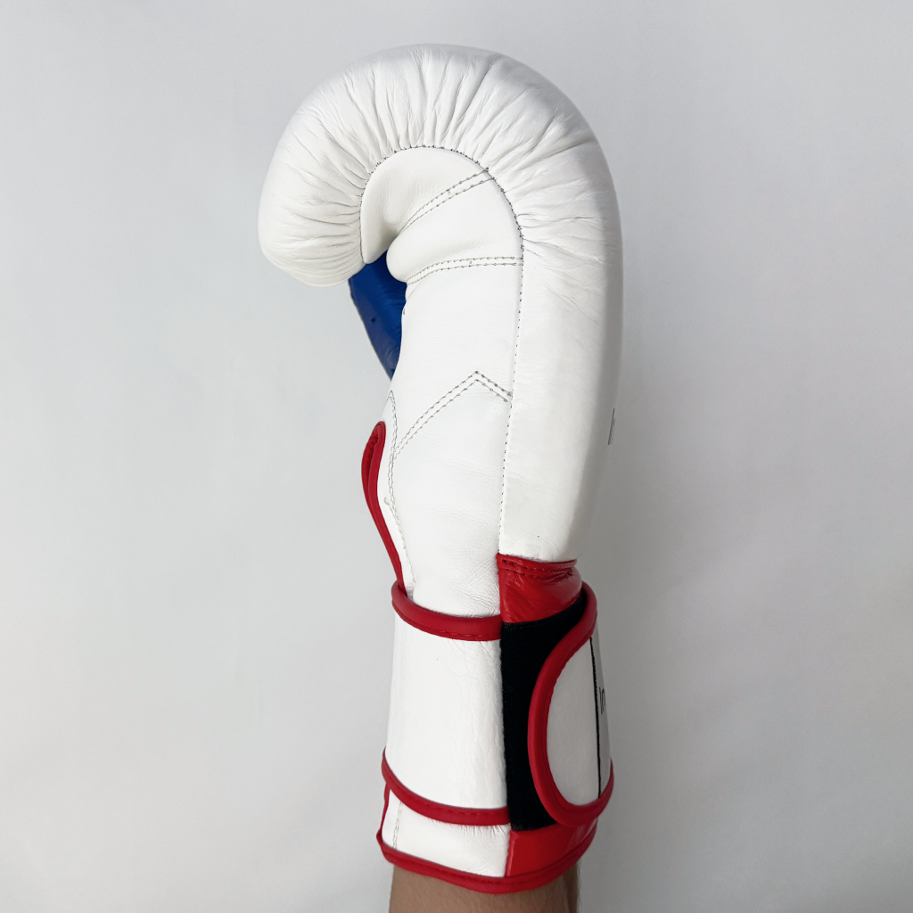 White boxing glove with red and blue accents on a light gray background