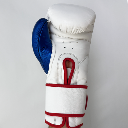 White boxing glove with blue and red accents on a light gray background