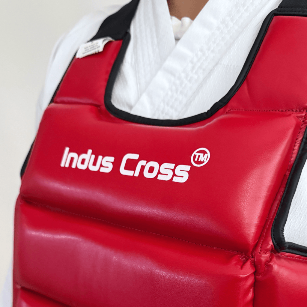 Red chest guard with 'Indus Cross' branding on a plain background