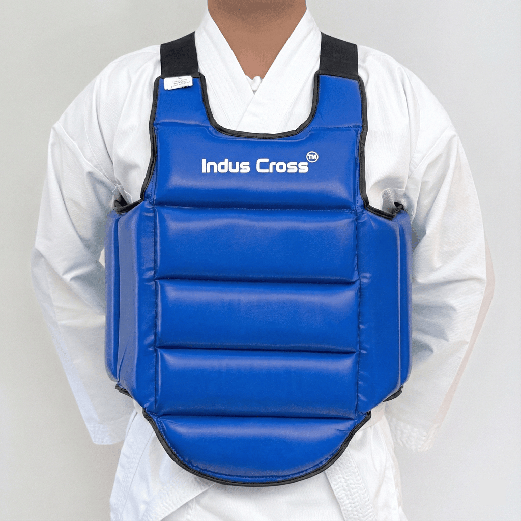Person wearing a blue chest guard with 'Indus Cross' branding on a gray background