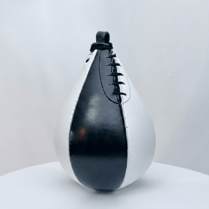 Black and white leather speed bag on a light gray background