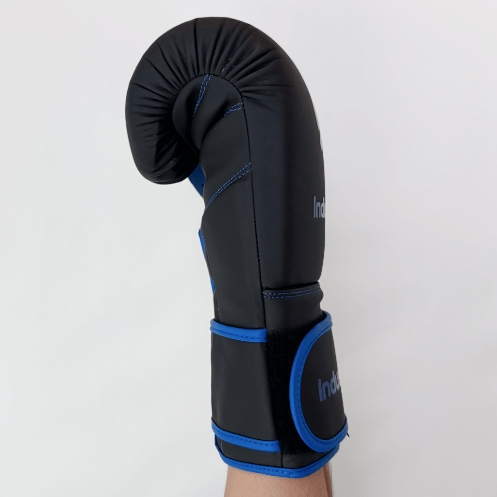 Black boxing glove with blue accents on a white background
